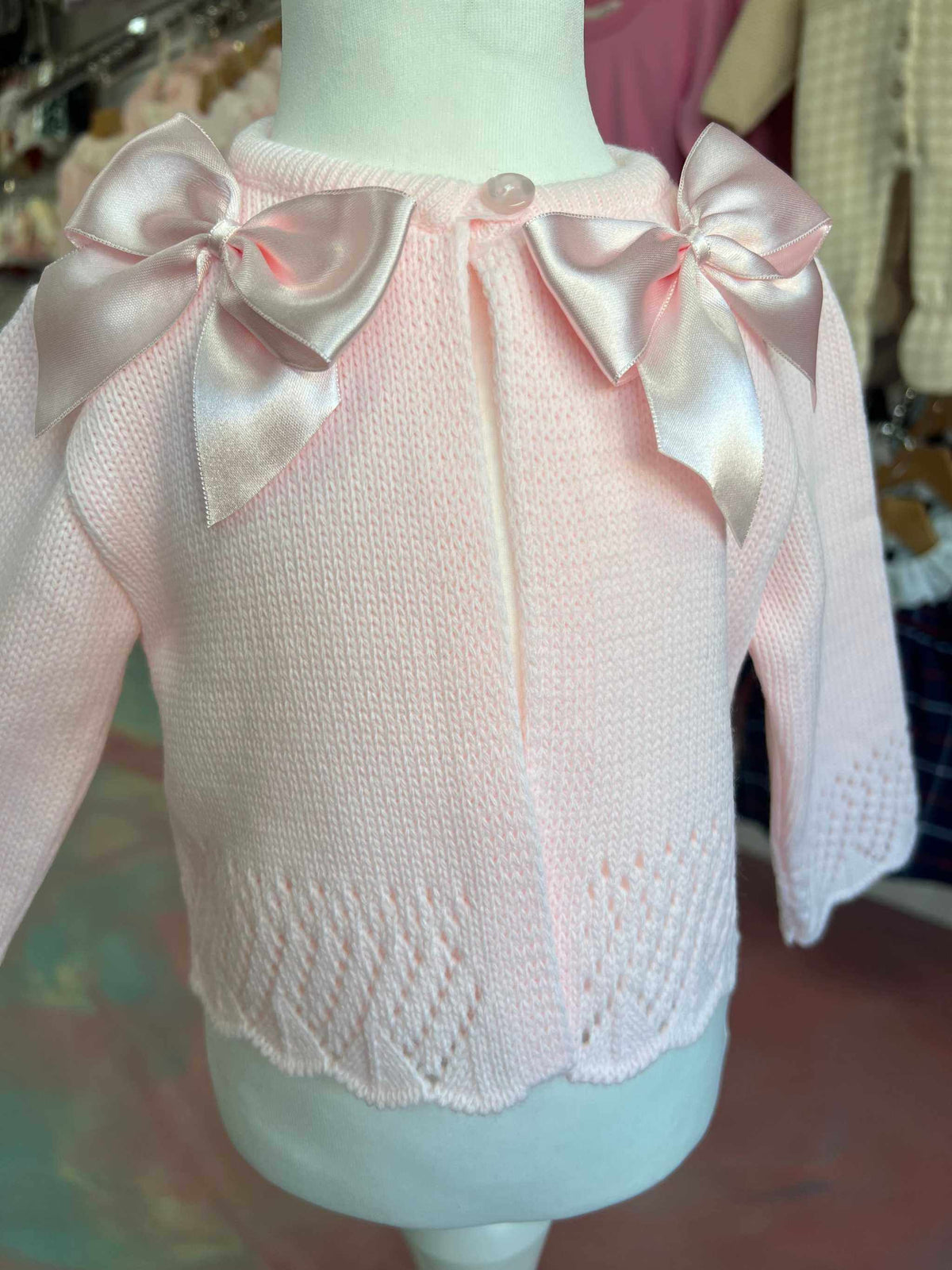 Pink cardigan with satin bows