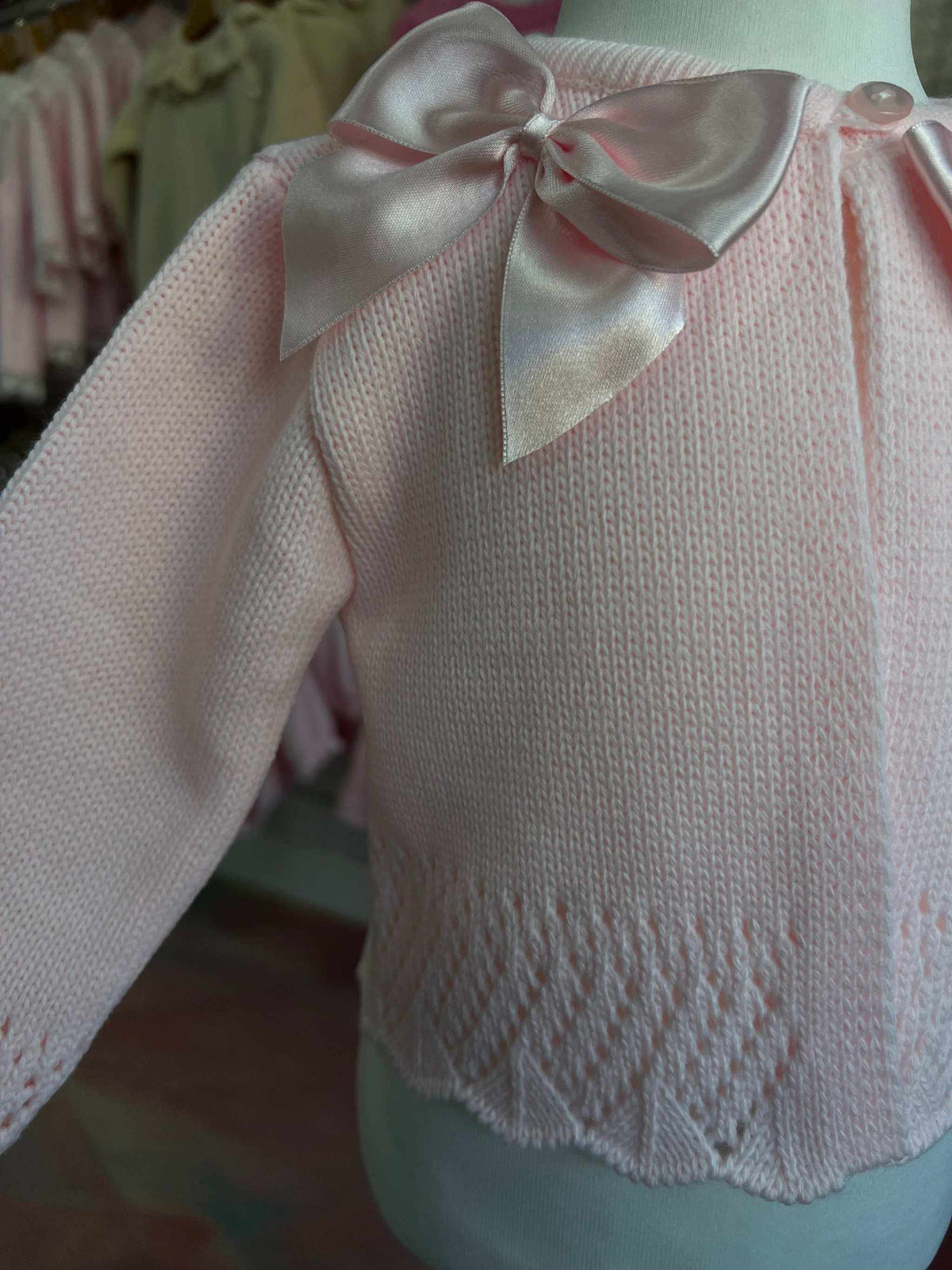 Pink cardigan with satin bows