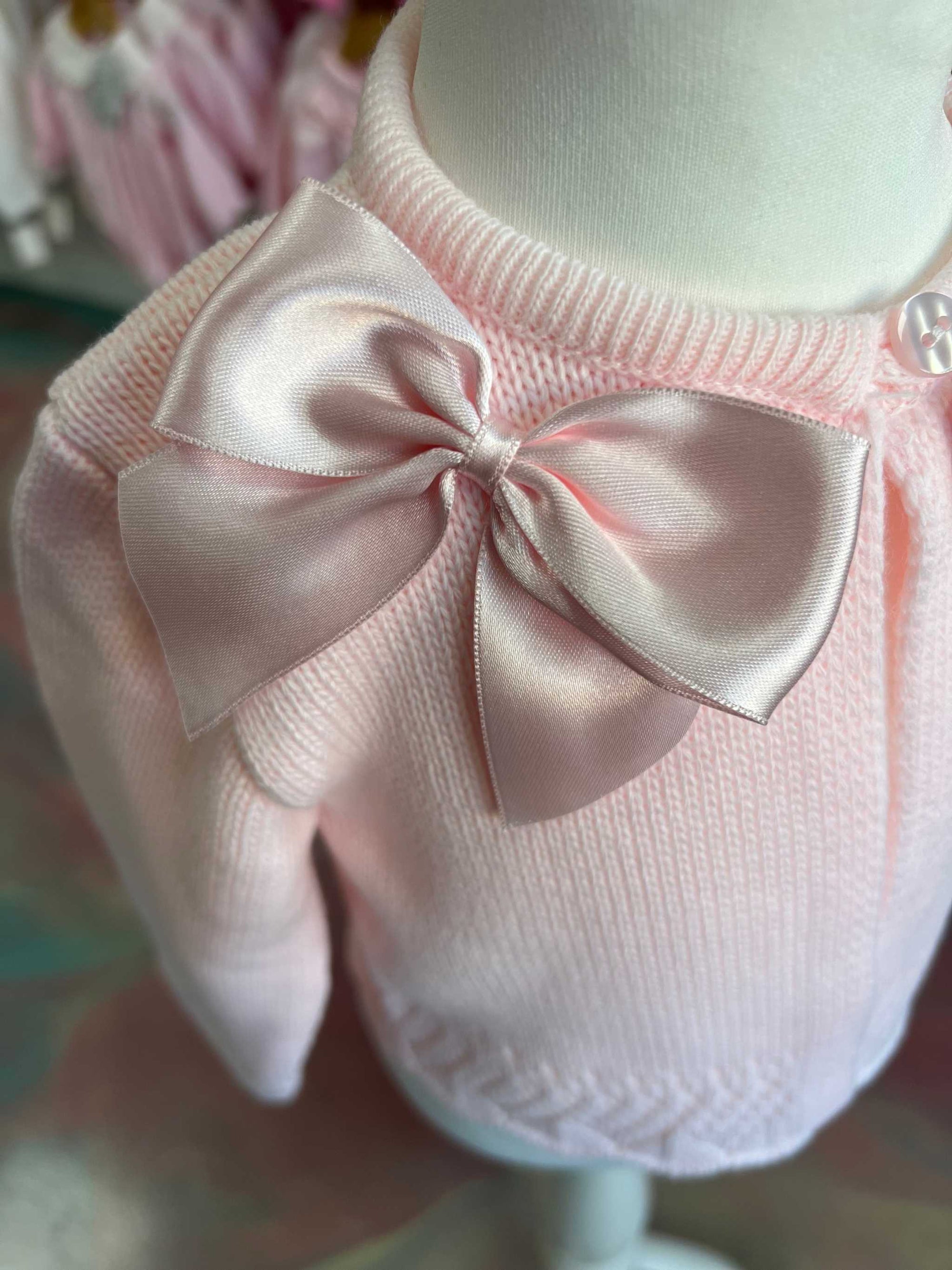 Pink cardigan with satin bows