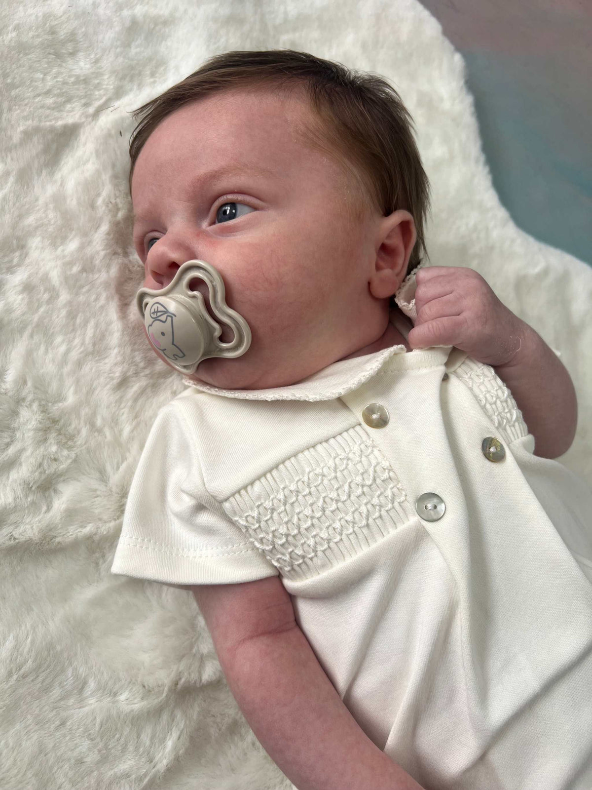 Unisex ivory smocked romper