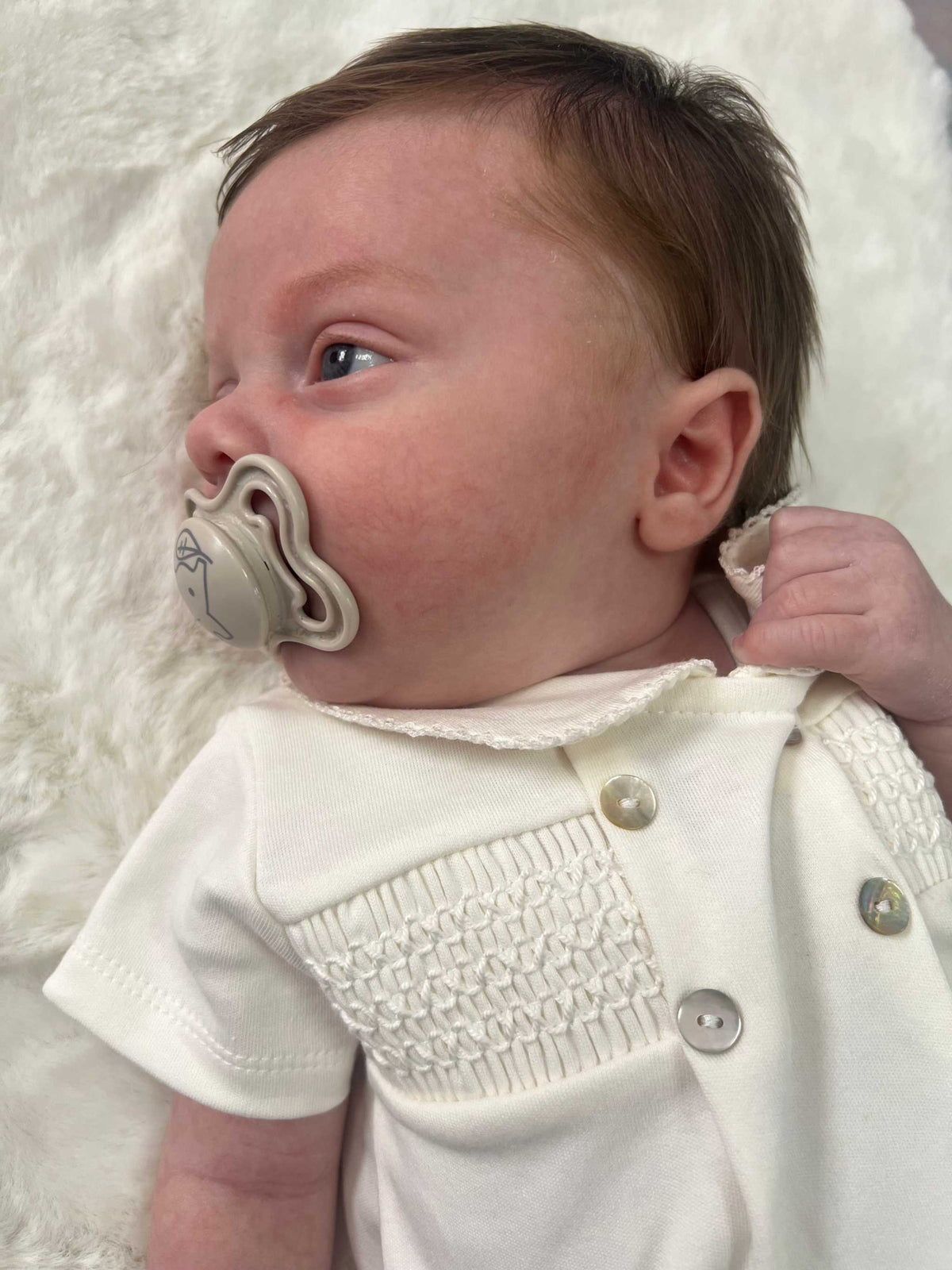 Unisex ivory smocked romper