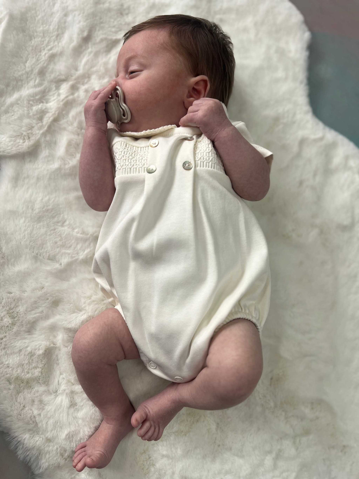 Unisex ivory smocked romper